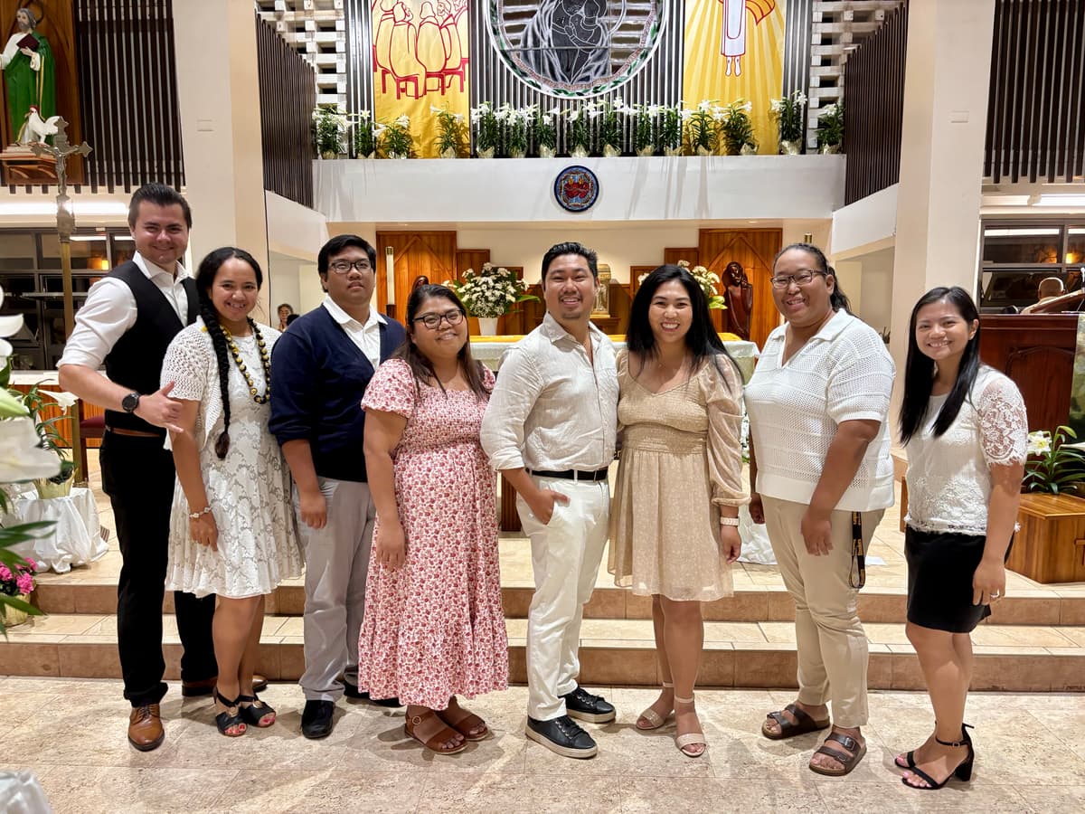 Group photo of Strive Young Adults in front of alter at Our Lady of Good Counsel Church